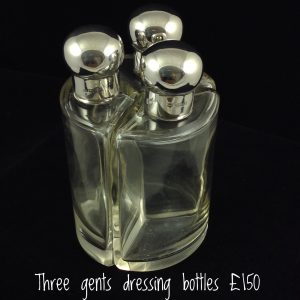 Silver topped gents dressing bottles 